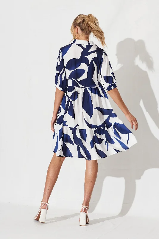 tamira-smock-dress-in-white-with-navy-print